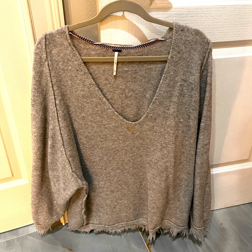 Free People gray sweater Size L oversized with fringe on bottom